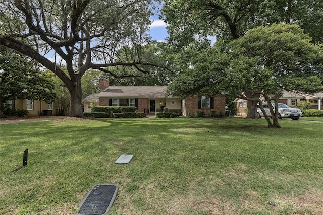 3824 Arundel Ave, Fort Worth, TX 76109 - ranch-style house featuring a chimney, a front lawn, and brick siding