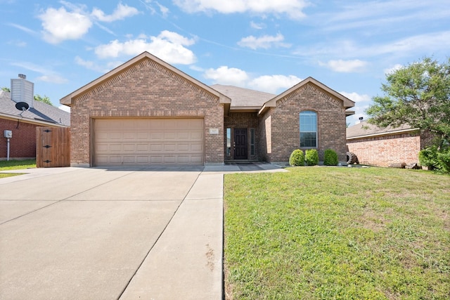 303 Stonegate Blvd, Alvarado, TX 76009 - single story home with brick siding, driveway, an attached garage, and a front lawn