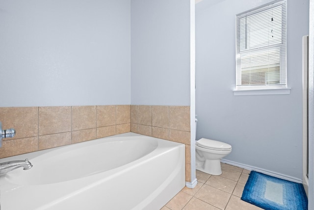303 Stonegate Blvd, Alvarado, TX 76009 - full bathroom with toilet, tile patterned floors, a bath, and baseboards