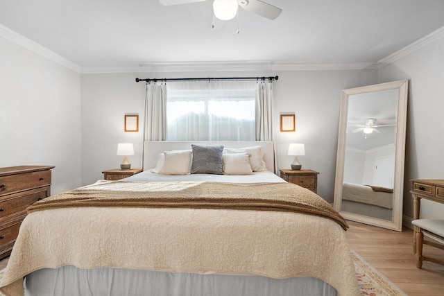 bedroom featuring light wood-style floors, ornamental molding, and ceiling fan