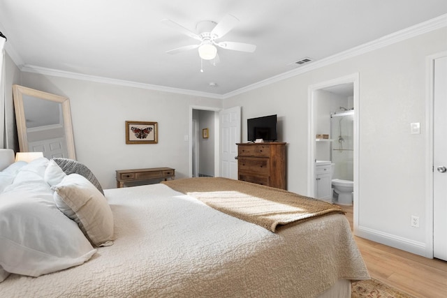 bedroom featuring crown molding, light wood-style floors, ensuite bathroom, baseboards, and ceiling fan