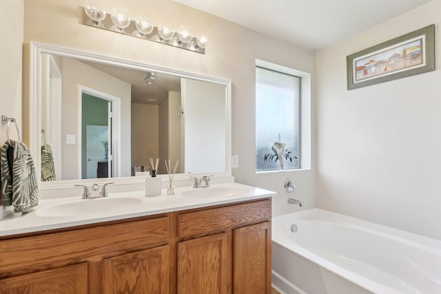 5530 Exeter Dr, Prosper, TX 75078 - bathroom with double vanity and a bath