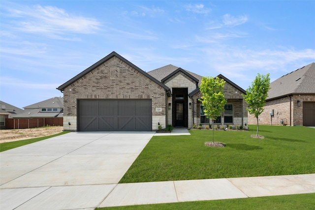 329 Lovett Ln, Burleson, TX 76028 - french country inspired facade featuring an attached garage, driveway, brick siding, and stone siding