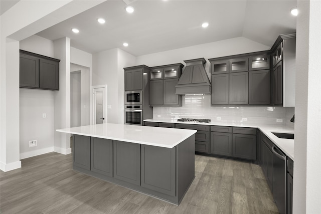 329 Lovett Ln, Burleson, TX 76028 - kitchen with appliances with stainless steel finishes, custom exhaust hood, a center island, tasteful backsplash, and lofted ceiling
