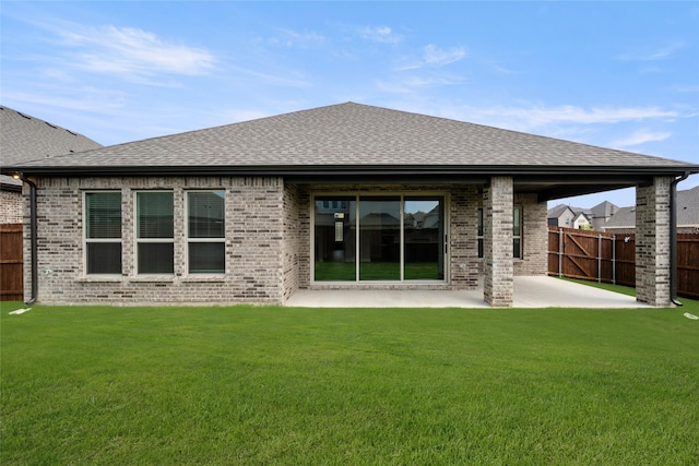 329 Lovett Ln, Burleson, TX 76028 - back of house with brick siding, a patio area, and roof with shingles