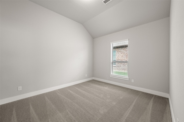 329 Lovett Ln, Burleson, TX 76028 - carpeted empty room featuring lofted ceiling and baseboards