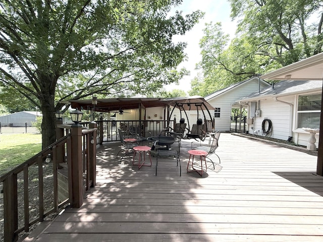 3335 Hedrick Ln, Princeton, TX 75407 - wooden terrace with ceiling fan, outdoor dining space, and a lawn