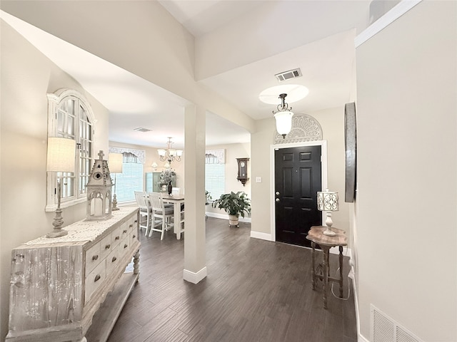 3335 Hedrick Ln, Princeton, TX 75407 - foyer featuring dark wood-type flooring, baseboards, and a chandelier