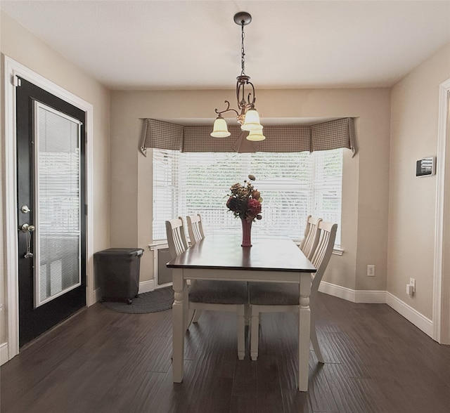 3335 Hedrick Ln, Princeton, TX 75407 - dining area with a chandelier, healthy amount of natural light, baseboards, and wood finished floors