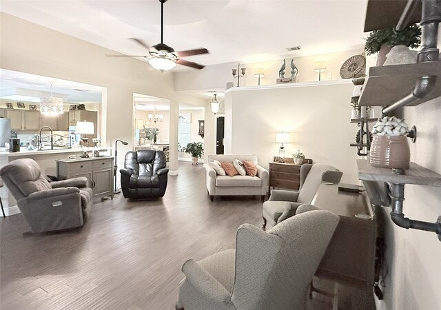 3335 Hedrick Ln, Princeton, TX 75407 - living area with a chandelier, wood finished floors, and a ceiling fan