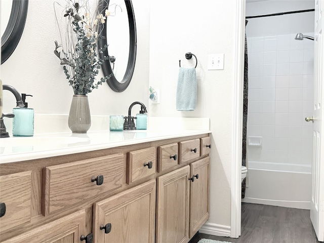 3335 Hedrick Ln, Princeton, TX 75407 - full bath with toilet, vanity, shower / bath combination with curtain, wood finished floors, and baseboards