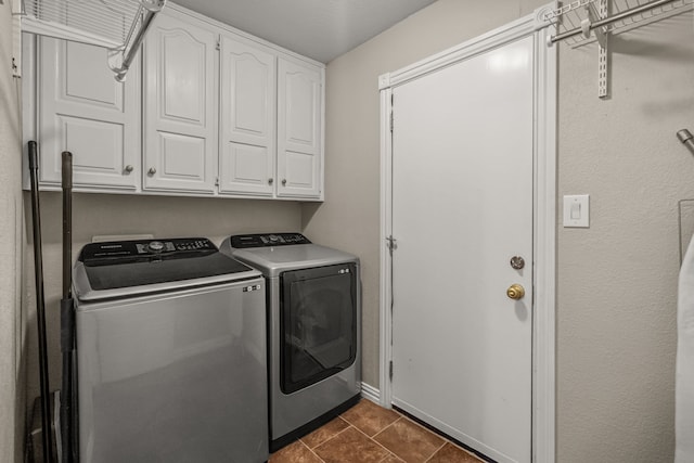 3304 Bowden Hill Ln N, Colleyville, TX 76034 - washroom featuring cabinet space, washing machine and dryer, and dark tile patterned flooring