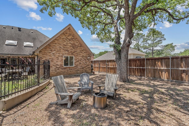 3304 Bowden Hill Ln N, Colleyville, TX 76034 - fenced backyard featuring an outdoor fire pit