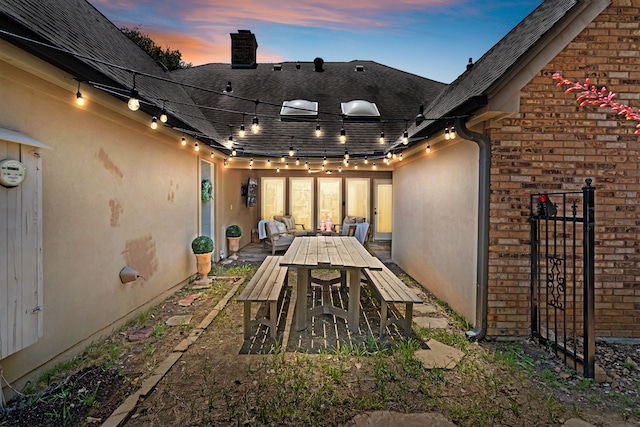 3304 Bowden Hill Ln N, Colleyville, TX 76034 - patio terrace at dusk featuring an outdoor hangout area and outdoor dining area
