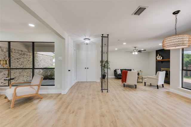 3 Collins Ct, Richardson, TX 75081 - living area with wood finished floors, recessed lighting, a fireplace, and ceiling fan