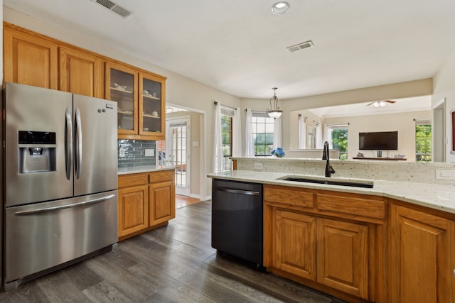 110 Man O War Ln, Fairview, TX 75069 - kitchen with stainless steel fridge with ice dispenser, a sink, dishwasher, brown cabinets, and dark wood-style flooring