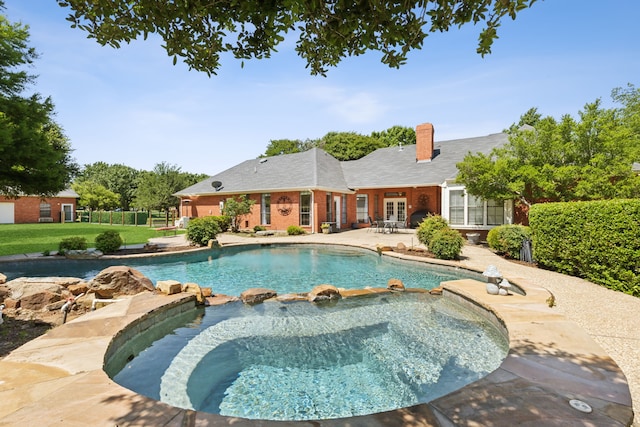 110 Man O War Ln, Fairview, TX 75069 - view of pool featuring a patio area, a pool with connected hot tub, and french doors