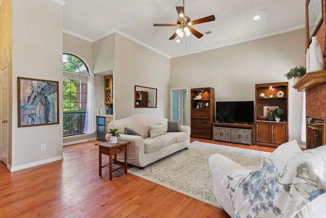 110 Man O War Ln, Fairview, TX 75069 - living area with ceiling fan, wood finished floors, baseboards, ornamental molding, and a towering ceiling