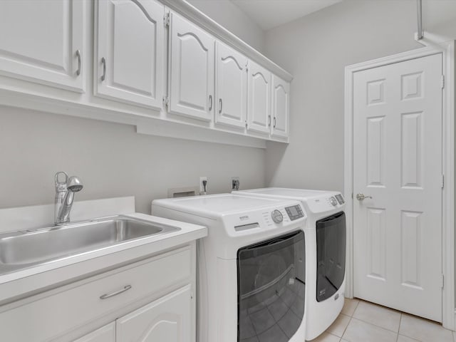 5904 Sandhills Cir, Plano, TX 75093 - washroom with cabinet space, washer and clothes dryer, and light tile patterned flooring