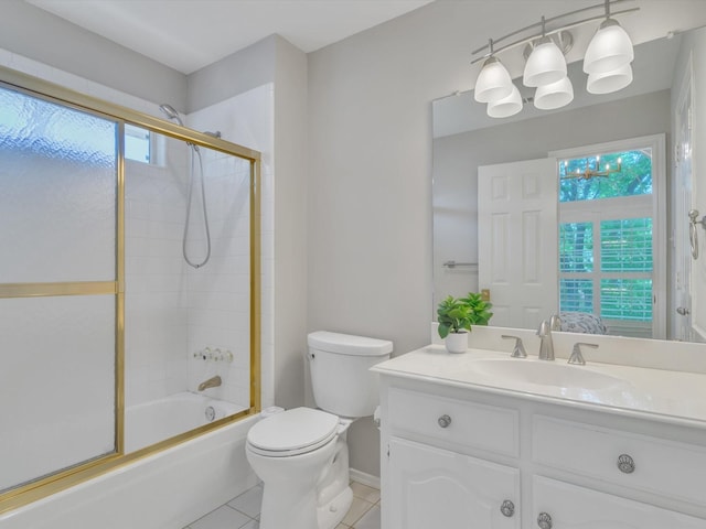 5904 Sandhills Cir, Plano, TX 75093 - full bathroom with tile patterned flooring, toilet, vanity, combined bath / shower with glass door, and baseboards