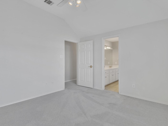 5904 Sandhills Cir, Plano, TX 75093 - unfurnished bedroom featuring light colored carpet, vaulted ceiling, baseboards, ensuite bathroom, and a ceiling fan