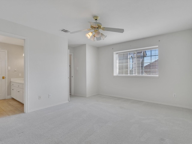 5904 Sandhills Cir, Plano, TX 75093 - unfurnished bedroom featuring light carpet, baseboards, ensuite bath, and a ceiling fan