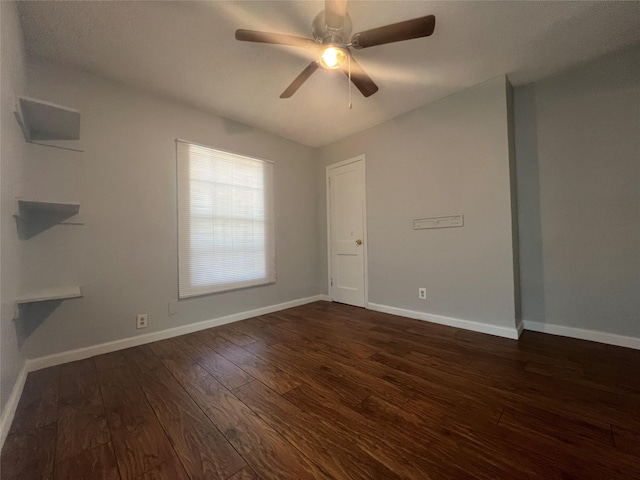 2722 Locust Ave, Dallas, TX 75216 - spare room featuring dark wood-style flooring, baseboards, and ceiling fan