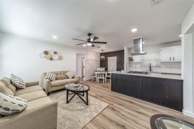 10816 Joaquin Dr, Dallas, TX 75228 - living room with light wood-type flooring, ceiling fan, and recessed lighting