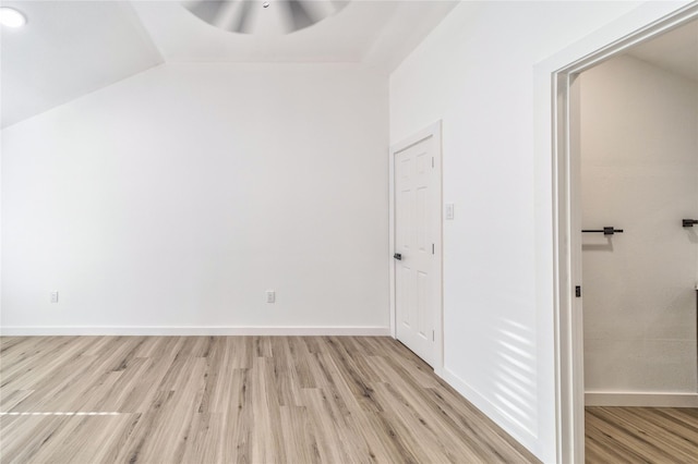 10816 Joaquin Dr, Dallas, TX 75228 - unfurnished bedroom featuring light wood-style floors, vaulted ceiling, baseboards, and a ceiling fan