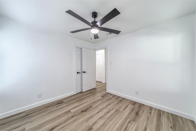 10816 Joaquin Dr, Dallas, TX 75228 - unfurnished room featuring light wood-style floors, baseboards, and ceiling fan