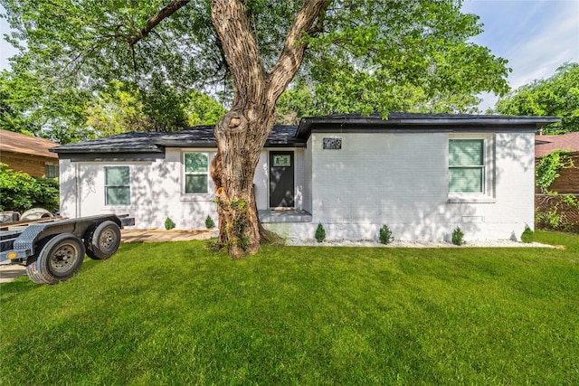 10816 Joaquin Dr, Dallas, TX 75228 - view of front of home with brick siding and a front yard