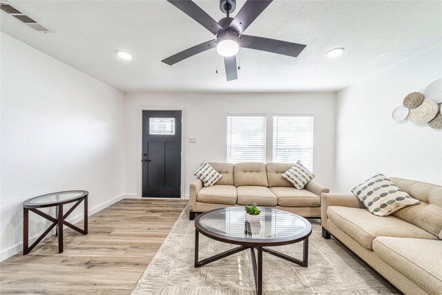 10816 Joaquin Dr, Dallas, TX 75228 - living room with ceiling fan, light wood-style floors, baseboards, and recessed lighting