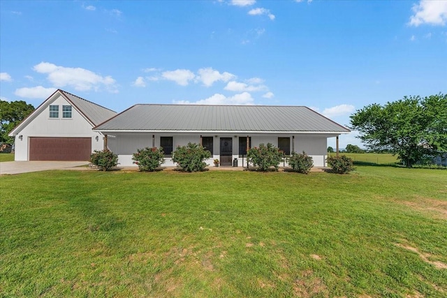 2250 Poolville Cut Off Rd, Poolville, TX 76487 - view of front facade featuring a garage, metal roof, a front yard, and concrete driveway