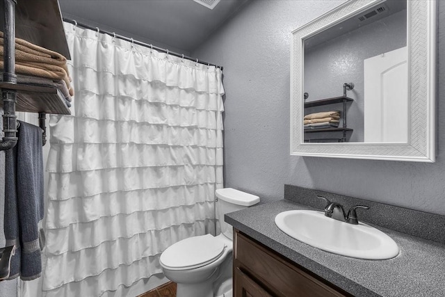 2250 Poolville Cut Off Rd, Poolville, TX 76487 - bathroom featuring a textured wall, vanity, toilet, and a shower with shower curtain