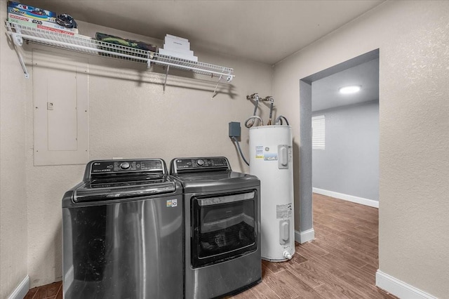 2250 Poolville Cut Off Rd, Poolville, TX 76487 - laundry room featuring water heater, washer and clothes dryer, wood finished floors, and baseboards