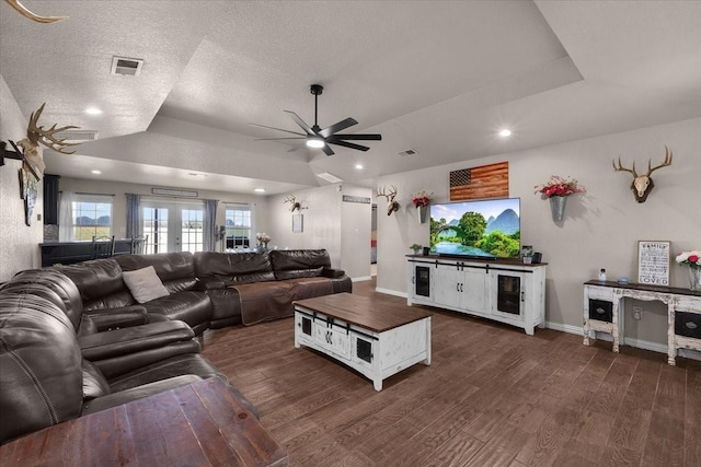 2250 Poolville Cut Off Rd, Poolville, TX 76487 - living area with a ceiling fan, a raised ceiling, dark wood-style floors, recessed lighting, and a textured ceiling