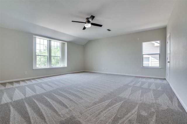 1618 Wildflower Dr, Waxahachie, TX 75165 - carpeted empty room featuring plenty of natural light, ceiling fan, baseboards, and vaulted ceiling