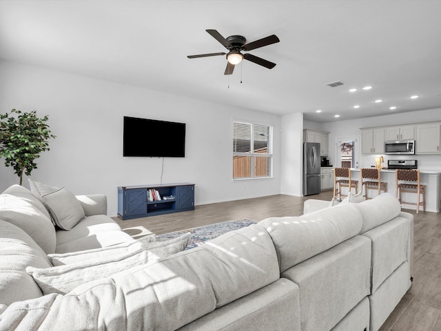 1705 Wayne Ln, Celina, TX 75009 - living area with ceiling fan, recessed lighting, and light wood finished floors
