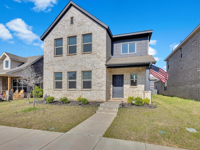 1705 Wayne Ln, Celina, TX 75009 - view of front of house featuring a front yard and brick siding