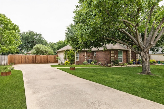 119 Palomino Ct, Shady Shores, TX 76208 - view of front of house with concrete driveway, brick siding, an attached garage, and central AC