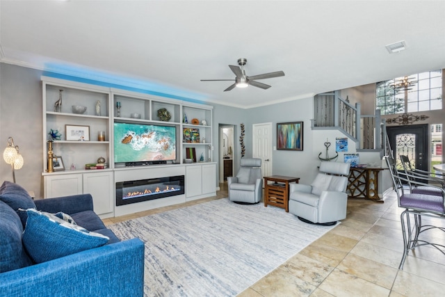 119 Palomino Ct, Shady Shores, TX 76208 - living room with ornamental molding, ceiling fan, a glass covered fireplace, and stairs