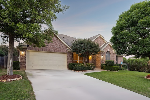 2806 Northwood St, Grapevine, TX 76051 - view of front facade featuring brick siding, driveway, and a garage