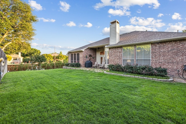 2806 Northwood St, Grapevine, TX 76051 - back of house featuring brick siding, a chimney, roof with shingles, and a patio area