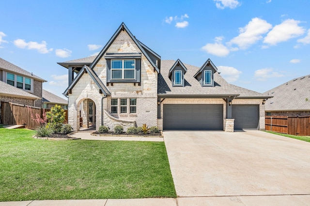 923 Timber Ridge Dr, Justin, TX 76247 - view of front facade with stone siding, an attached garage, driveway, roof with shingles, and brick siding