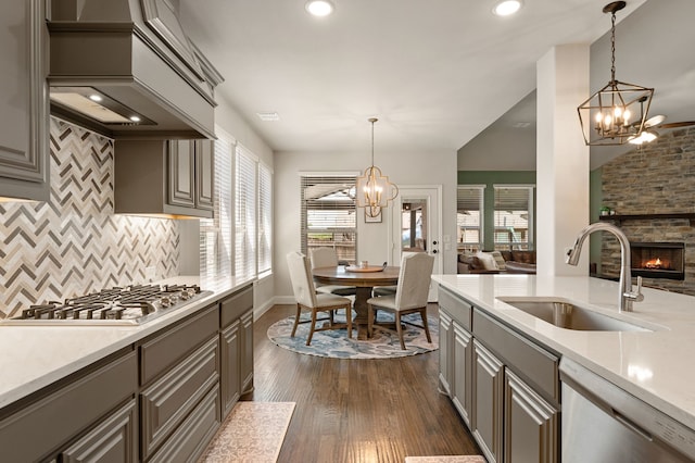 923 Timber Ridge Dr, Justin, TX 76247 - kitchen featuring gray cabinets, a chandelier, a sink, appliances with stainless steel finishes, and recessed lighting
