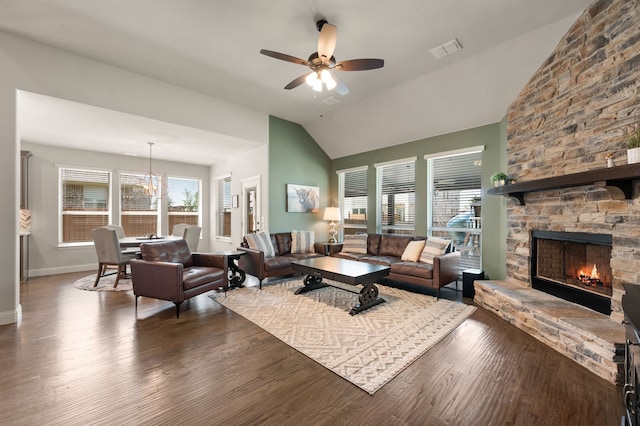 923 Timber Ridge Dr, Justin, TX 76247 - living area with vaulted ceiling, a ceiling fan, a stone fireplace, wood finished floors, and baseboards