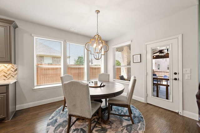 923 Timber Ridge Dr, Justin, TX 76247 - dining room featuring a chandelier, baseboards, and dark wood-style floors