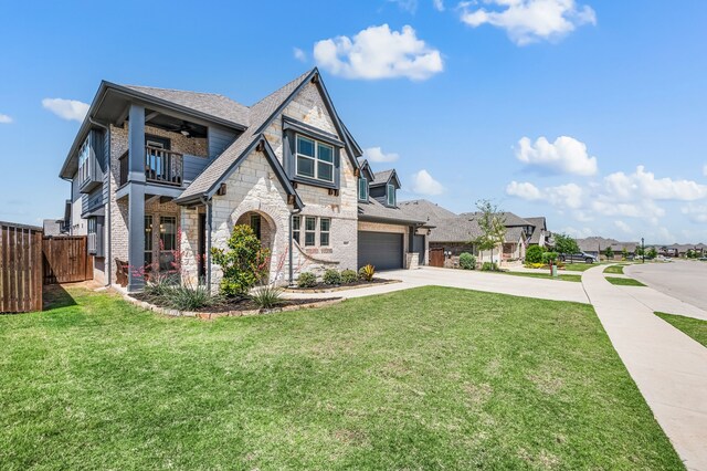 923 Timber Ridge Dr, Justin, TX 76247 - view of front facade with a balcony, driveway, stone siding, a residential view, and an attached garage