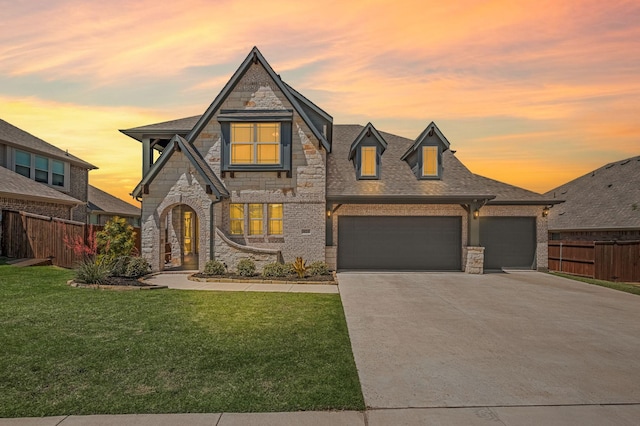 923 Timber Ridge Dr, Justin, TX 76247 - french country home featuring stone siding, concrete driveway, a garage, and roof with shingles