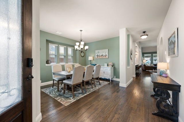 923 Timber Ridge Dr, Justin, TX 76247 - dining room with a chandelier, dark wood-type flooring, and healthy amount of natural light